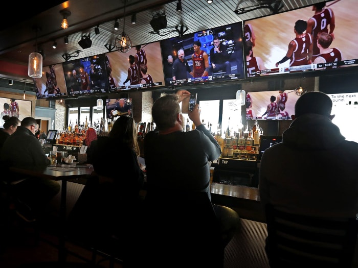 Patrons take in the tournament from a bar in Indy